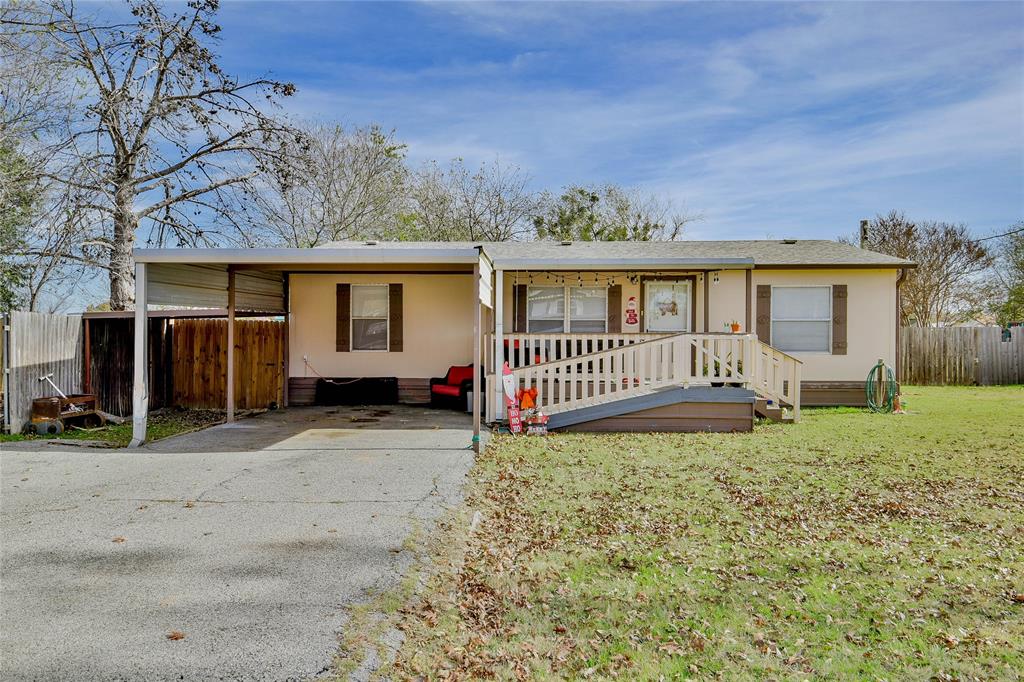 214 Gandy Street Lipan, TX 76462 - Photo 4 of 40 a front view of a house with garden