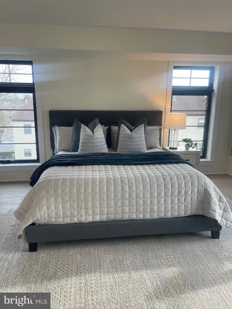 a bedroom with a bed and window