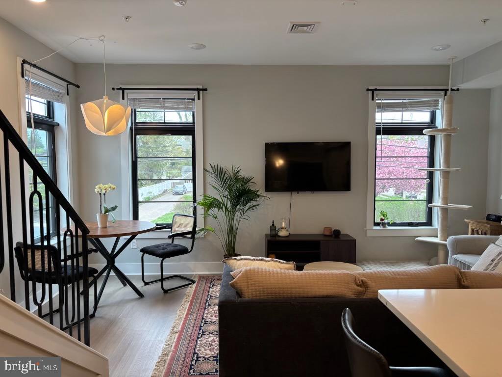 7521 Ridge Avenue Philadelphia, PA 19128 - Photo 2 of 13 a living room with furniture and a flat screen tv