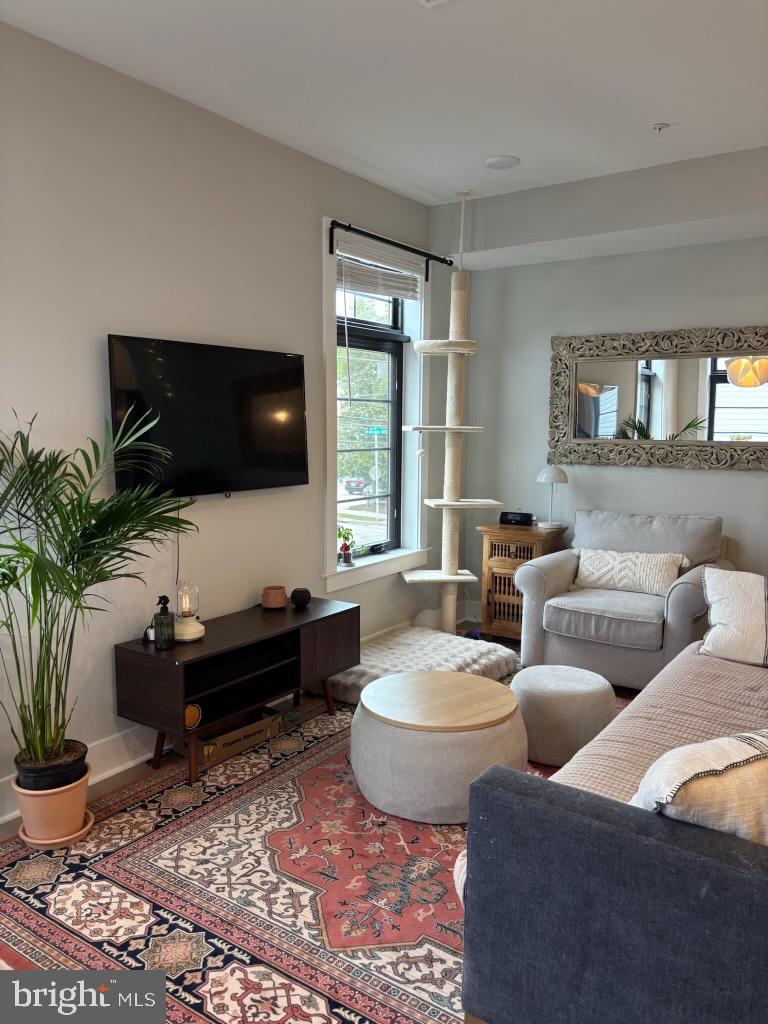 7521 Ridge Avenue Philadelphia, PA 19128 - Photo 5 of 13 a living room with furniture and a flat screen tv