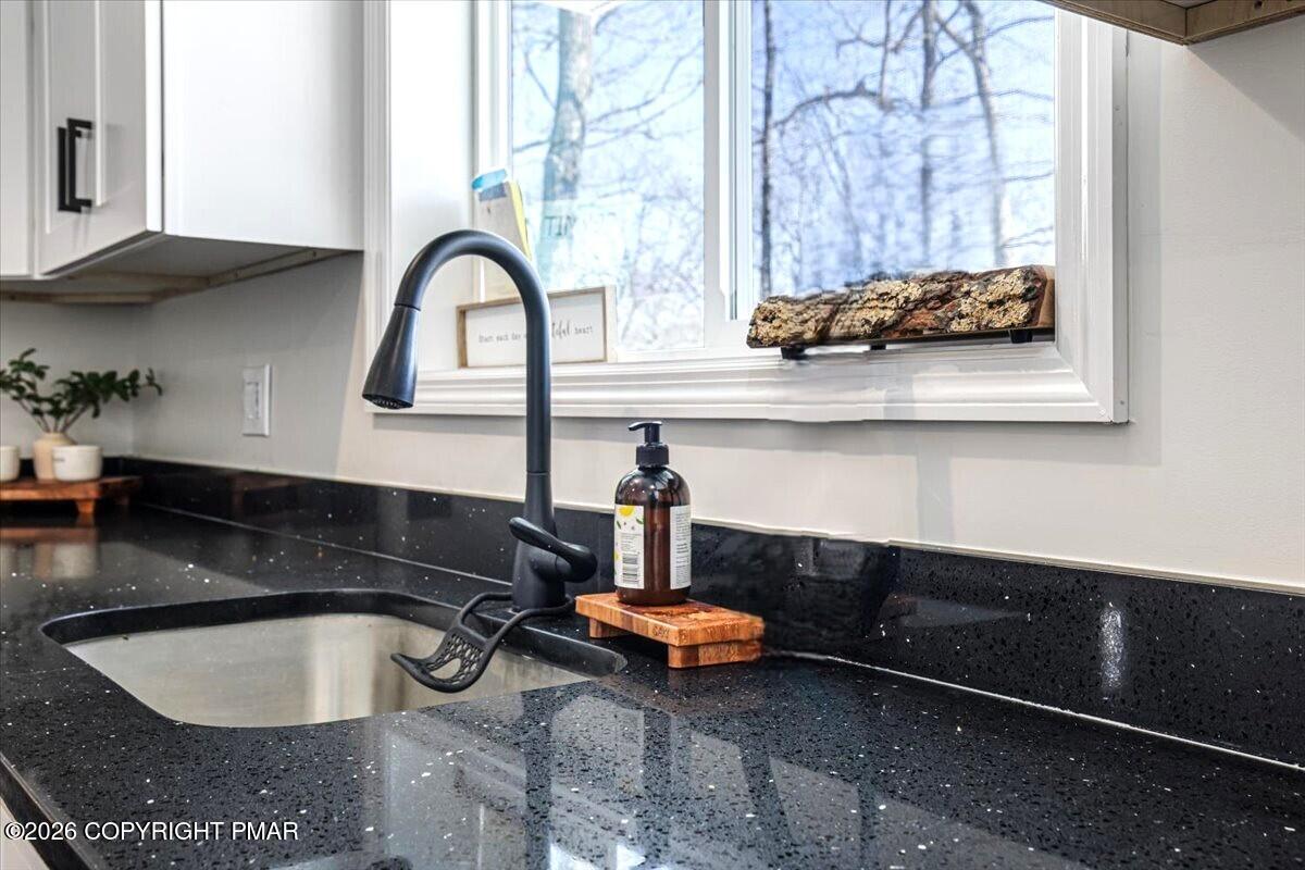 5873 Decker Road Bushkill, PA 18324 - Photo 32 of 57 a bathroom with a sink and a window