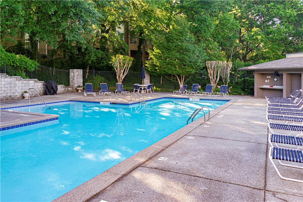 19 Finch Trail Northeast Atlanta, GA 30308 - Photo 25 of 28 a view of a swimming pool with sitting area and furniture