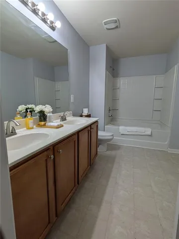 a bathroom with a sink a vanity and mirror