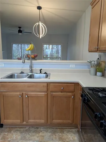 a kitchen with a sink and cabinets