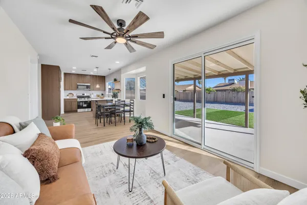 a living room with furniture and a large window