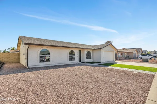 a house with swimming pool in front of it