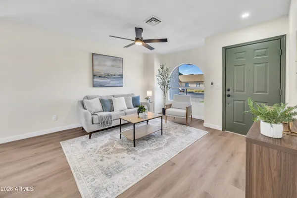 a living room with furniture and a window