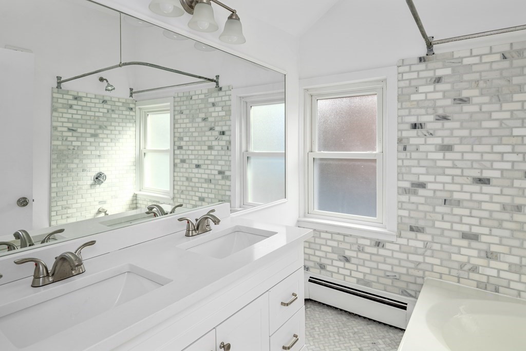 15 Fayette Street, Unit 7 Boston, MA 02116 - Photo 12 of 16 a bathroom with a sink and a mirror