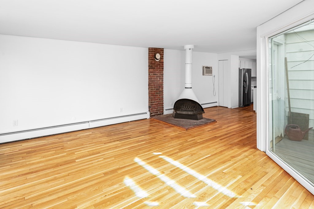 15 Fayette Street, Unit 7 Boston, MA 02116 - Photo 3 of 16 a view of a room with wooden floor and closet