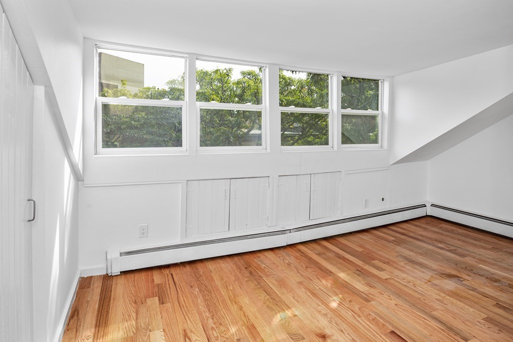 15 Fayette Street, Unit 7 Boston, MA 02116 - Photo 8 of 16 a view of a room with wooden floor and natural light