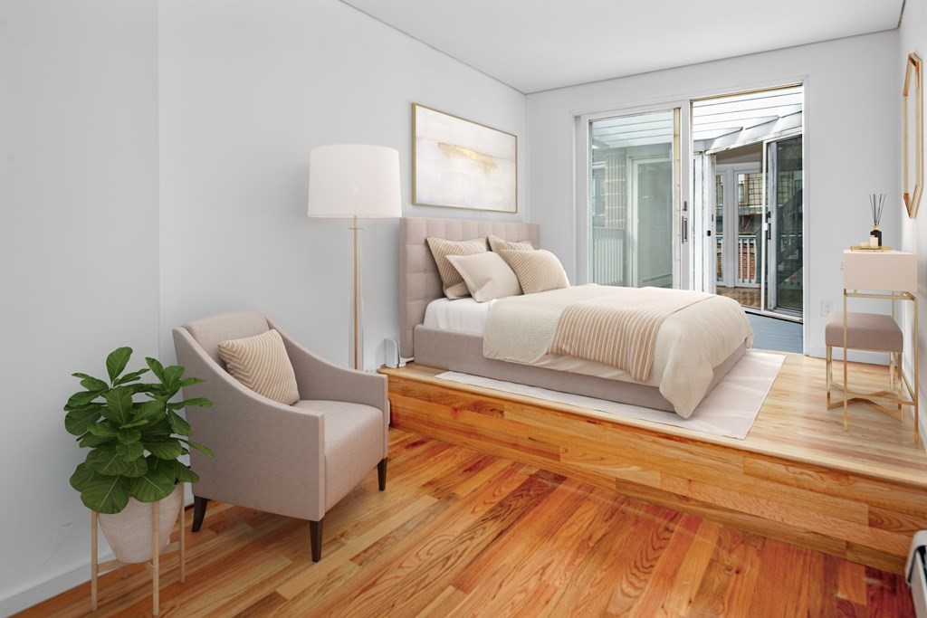 15 Fayette Street, Unit 7 Boston, MA 02116 - Photo 10 of 16 a bedroom with a bed and a potted plant