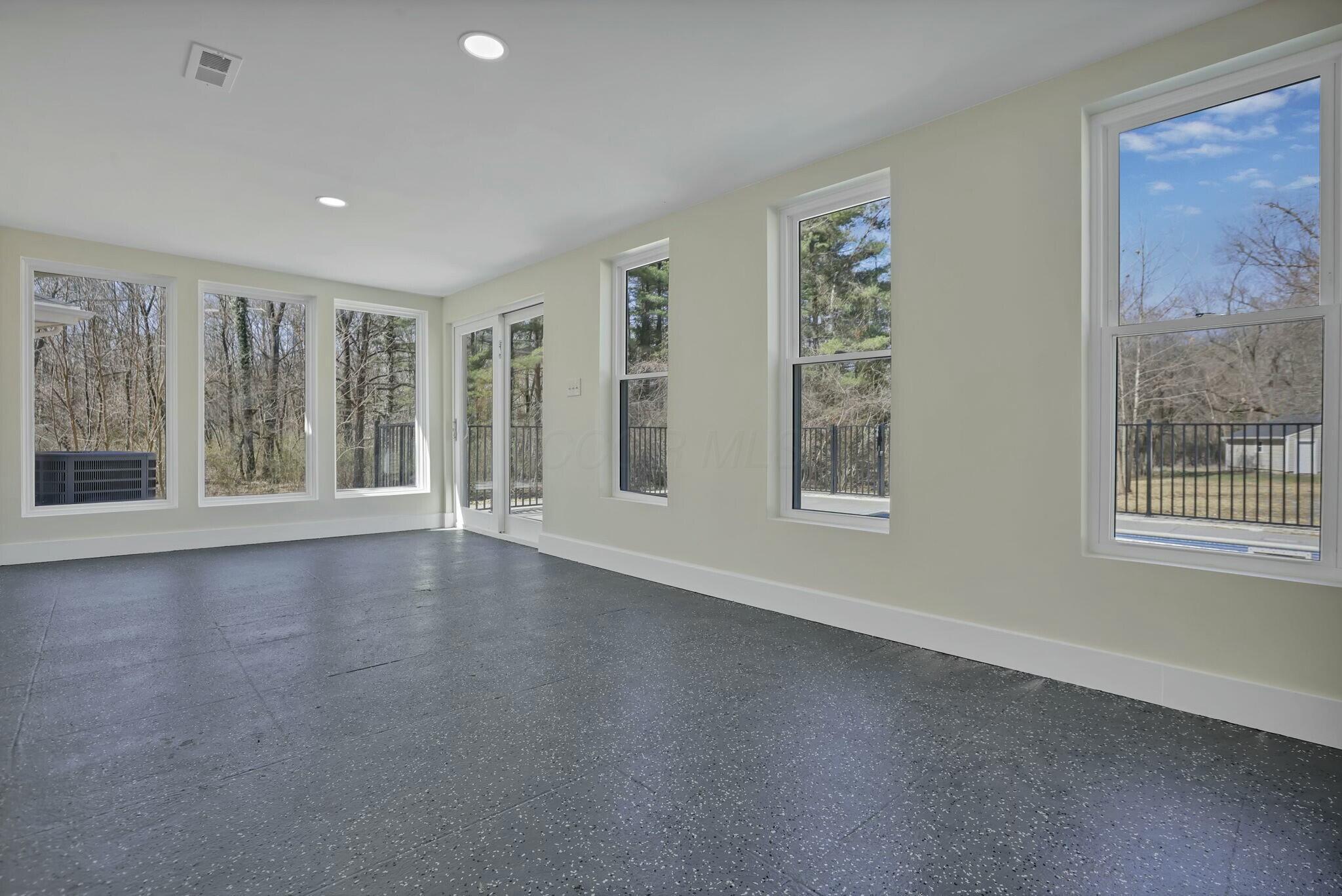 3301 Daglow Road Columbus, OH 43232 - Photo 43 of 60 Four Season Room with 7 windows - opens to the POOL!