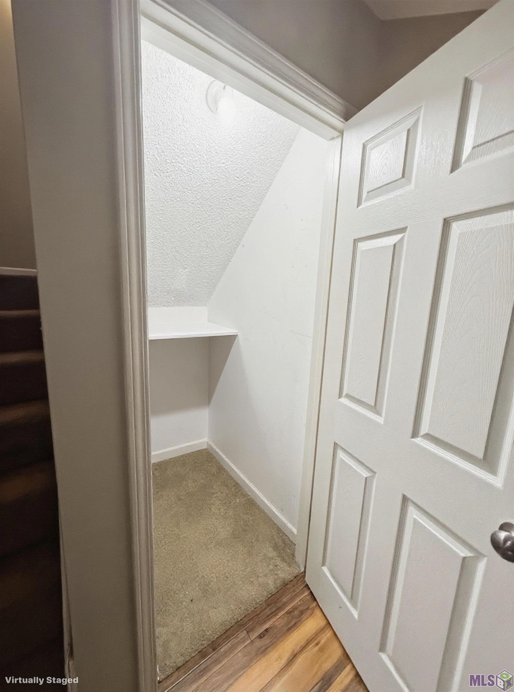 141 East Boyd Drive, Unit 607 Baton Rouge, LA 70808 - Photo 8 of 22 Storage closet under stairs