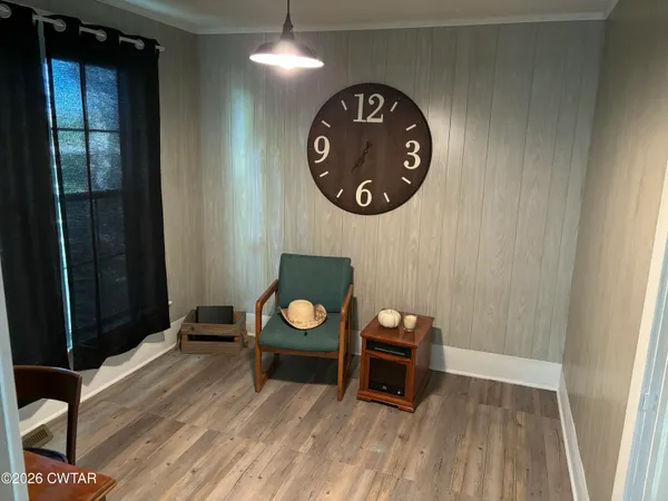 an outdoor space with wooden floor