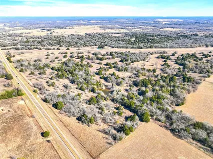 a view of a field with an ocean