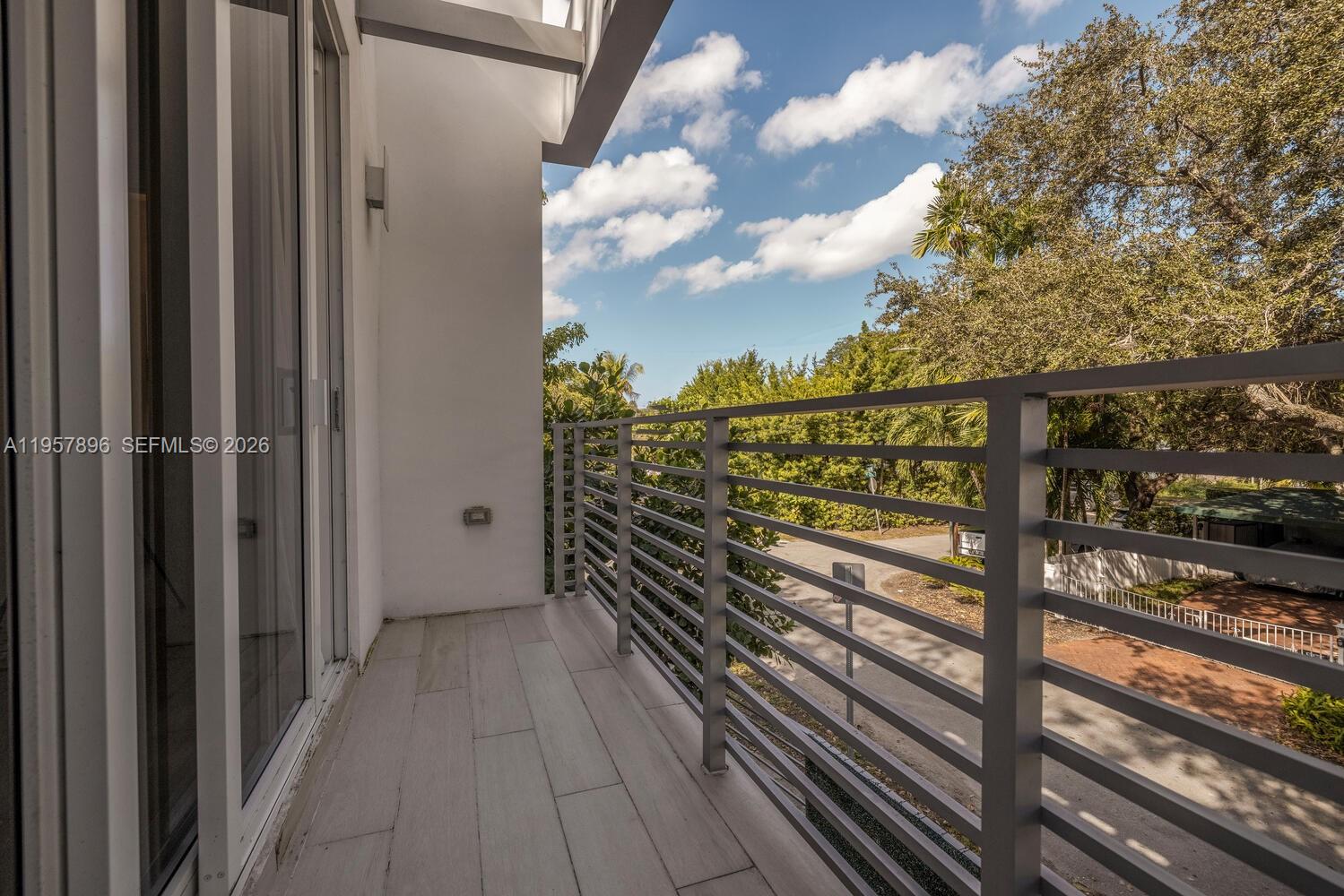 2851 Southwest 33rd Court, Unit 2851 Miami, FL 33133 - Photo 30 of 45 a view of a balcony with wooden floor