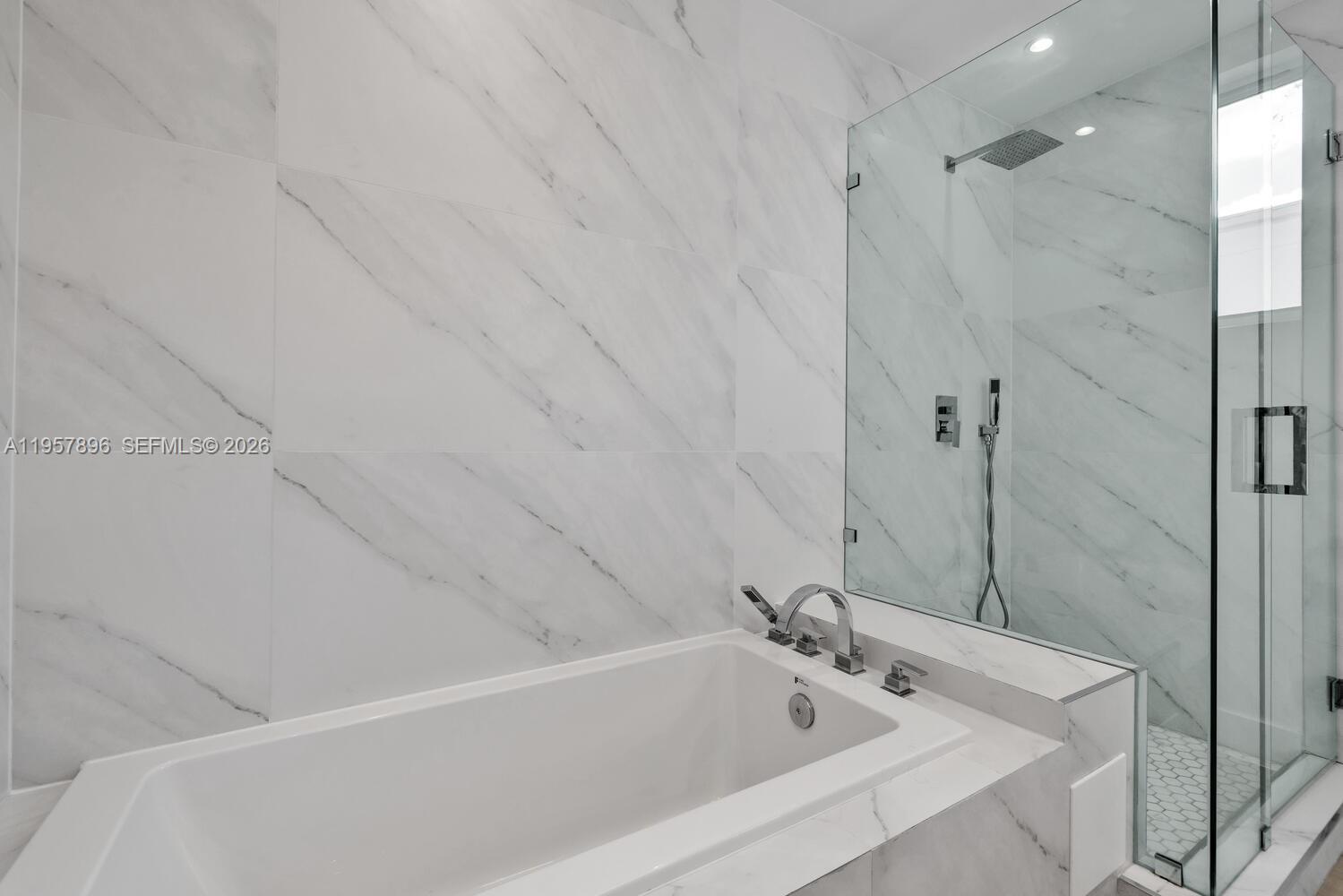2851 Southwest 33rd Court, Unit 2851 Miami, FL 33133 - Photo 35 of 45 a bathroom with a tub and a shower