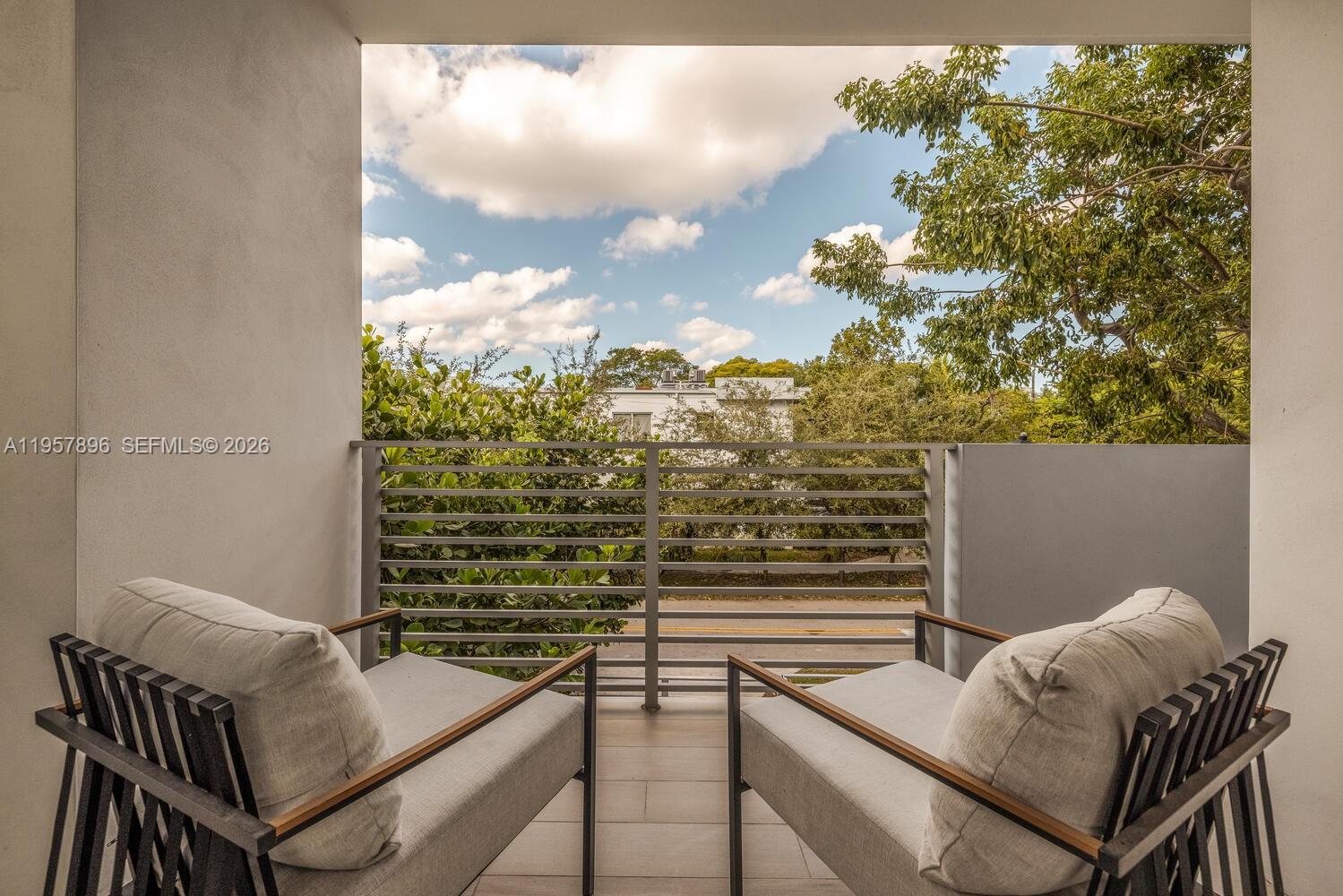 2851 Southwest 33rd Court, Unit 2851 Miami, FL 33133 - Photo 40 of 45 a view of balcony with two chairs and a table