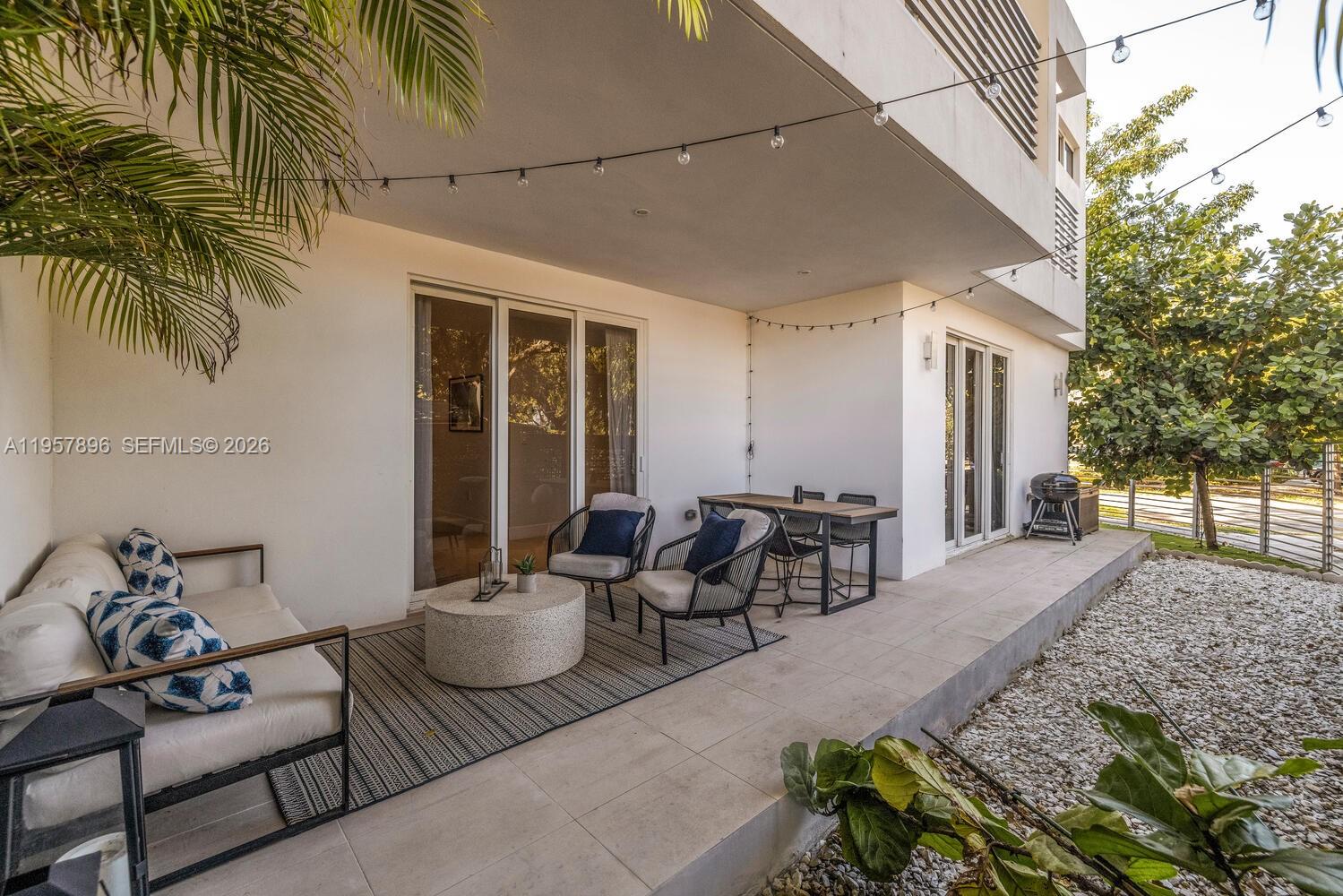 2851 Southwest 33rd Court, Unit 2851 Miami, FL 33133 - Photo 6 of 45 a view of a patio with couple of chairs and potted plants