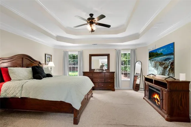 a bedroom with a bed and a fireplace
