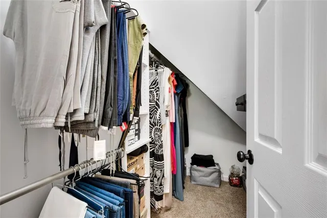a bathroom with a granite countertop tub shower and a sink