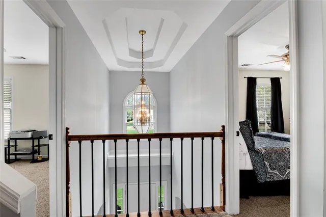 a bedroom with a bed dresser and a window