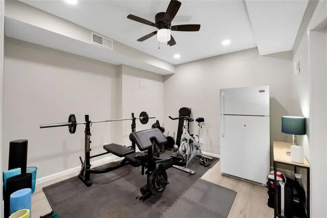a view of a porch with furniture and wooden floor