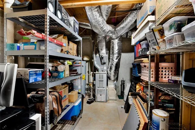 a view of a livingroom with furniture wooden floor and a window