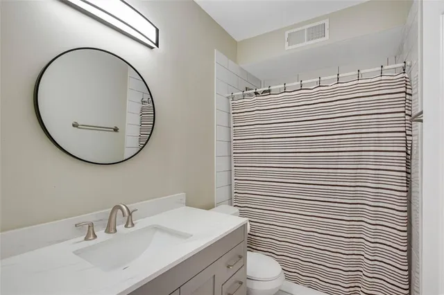 a view of a garden with furniture and garden