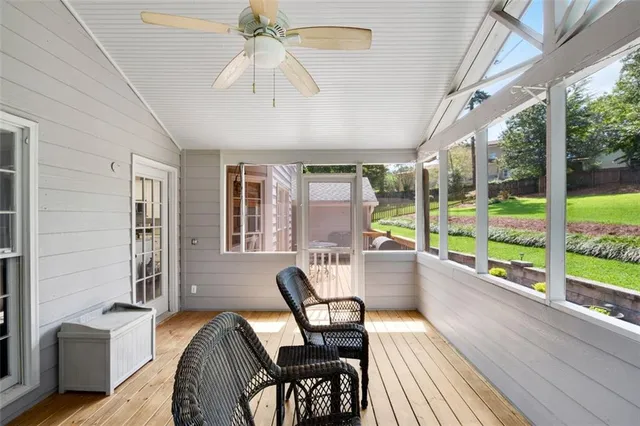 a view of a grassy field with trees