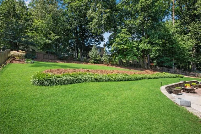 a view of a backyard with sitting area