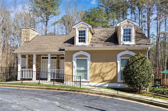 a view of a backyard with sitting area