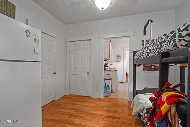 a bedroom with a bed and a closet