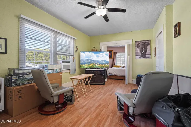 a workspace with furniture and a large window