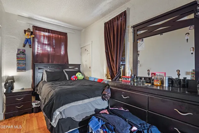 a bedroom with a bed and dresser