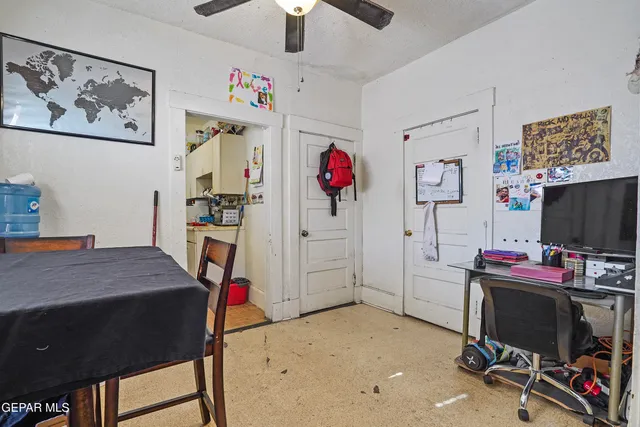 a bedroom with a workspace