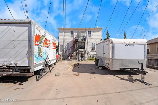 a room with gym equipment and a flat screen tv