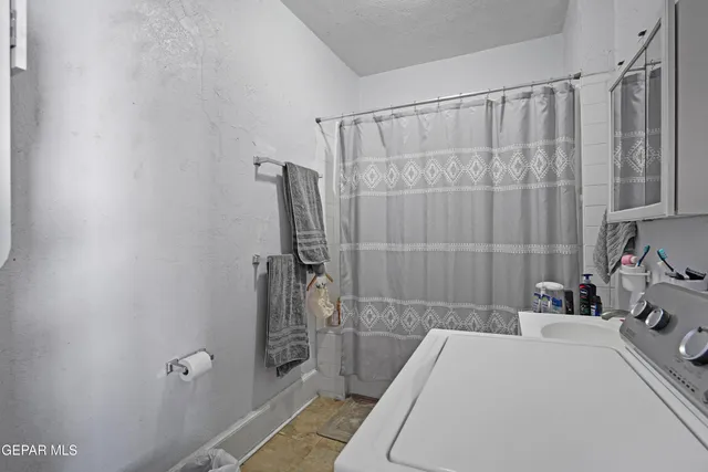 a bathroom with a sink and shower