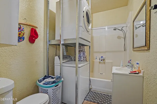 a bathroom with a toilet and a shower curtain