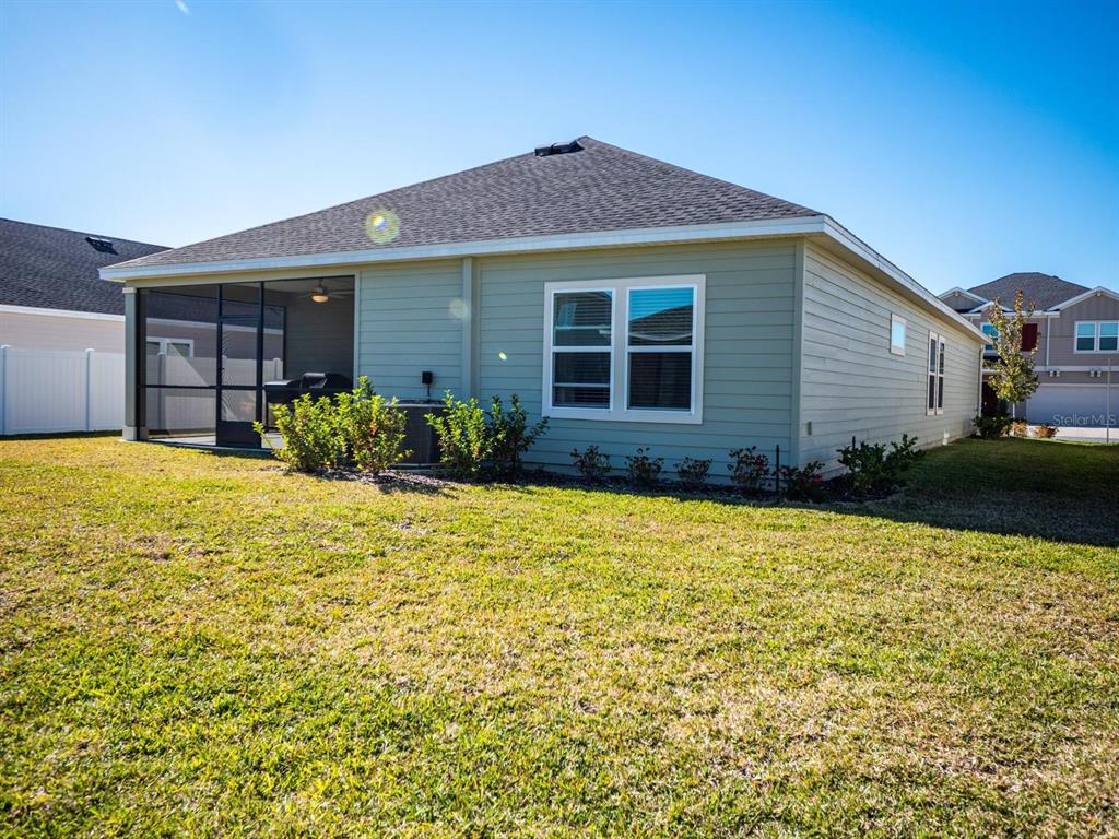 9052 Southwest 58th Circle Ocala, FL 34476 - Photo 14 of 19 a front view of a house with a yard