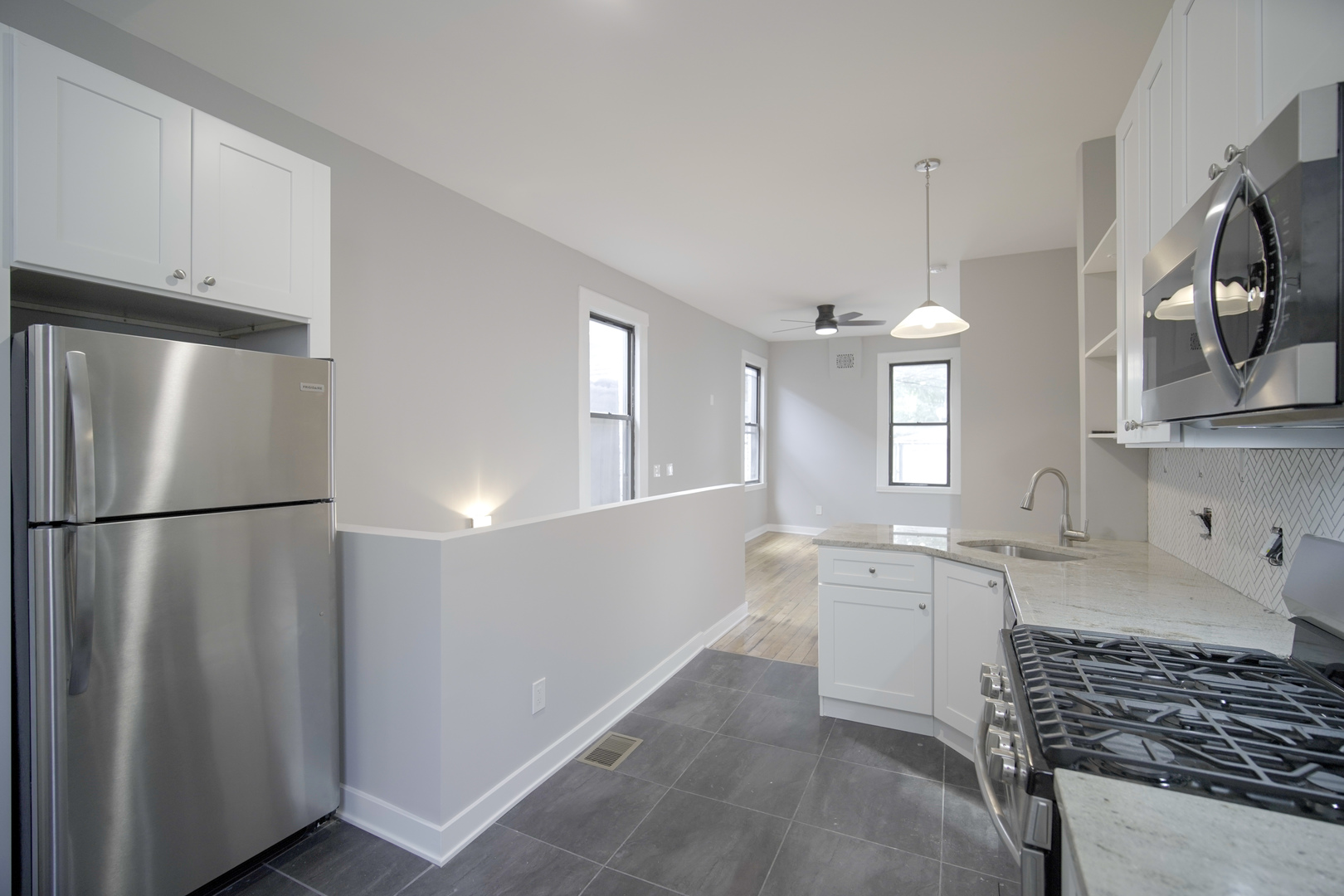 2235 West Cullerton Street Chicago, IL 60608 - Photo 13 of 15 a kitchen with stainless steel appliances a refrigerator sink and cabinets