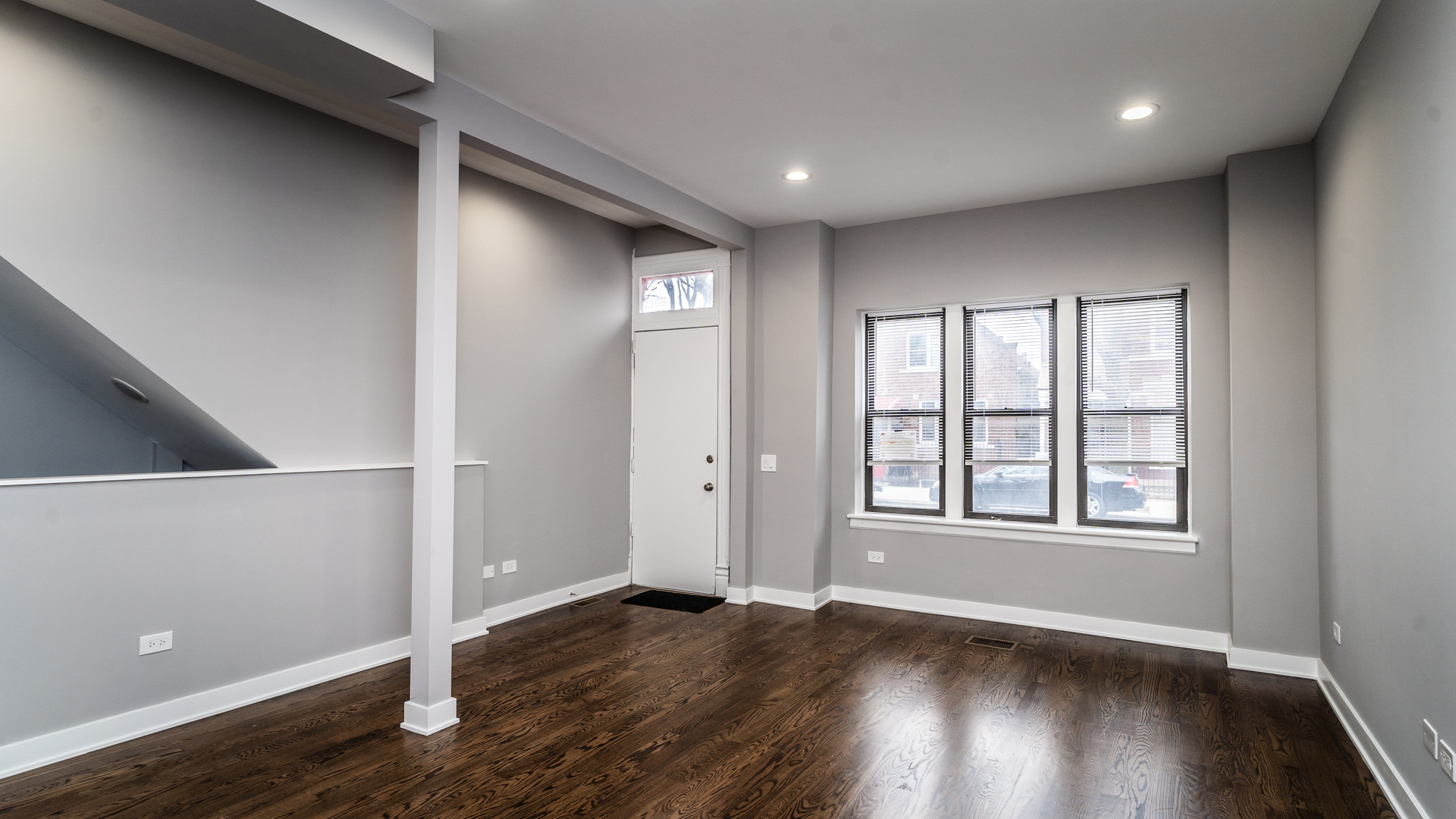 2235 West Cullerton Street Chicago, IL 60608 - Photo 3 of 15 an empty room with wooden floor and windows