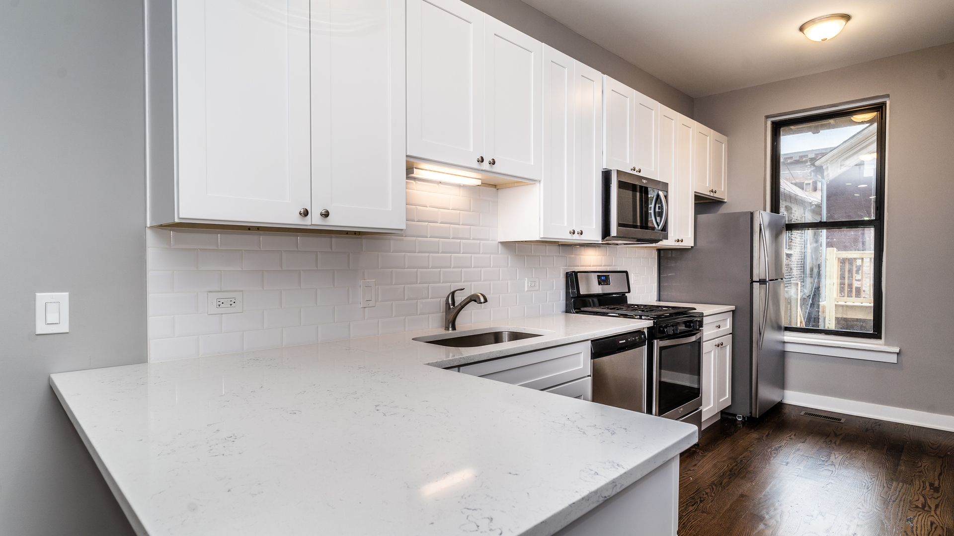 2235 West Cullerton Street Chicago, IL 60608 - Photo 6 of 15 a kitchen with stainless steel appliances a stove a sink a microwave and cabinets