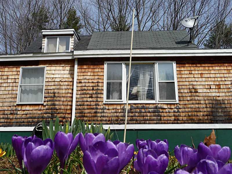 14 Gould Road Jefferson, ME 04348 - Photo 2 of 29 Exterior Front. FLower Garden out front
