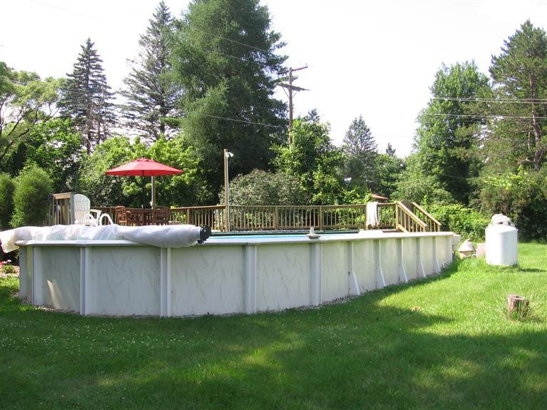 7450 Chamberlin Road Dexter, MI 48130 - Photo 28 of 36 Pool from behind away from House.