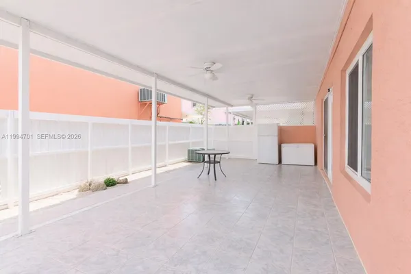 a view of a room with a large window