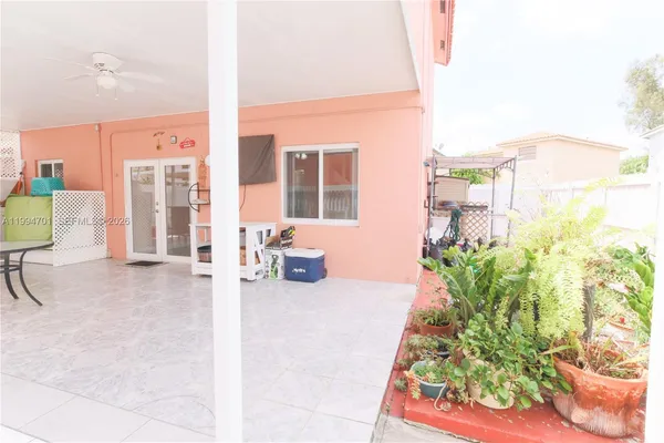 a living room with furniture and a lamp
