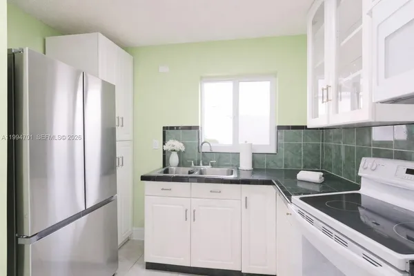 a kitchen with a sink and cabinets