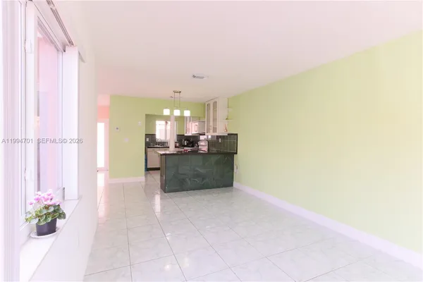 a view of a kitchen with granite countertop cabinets and a sink