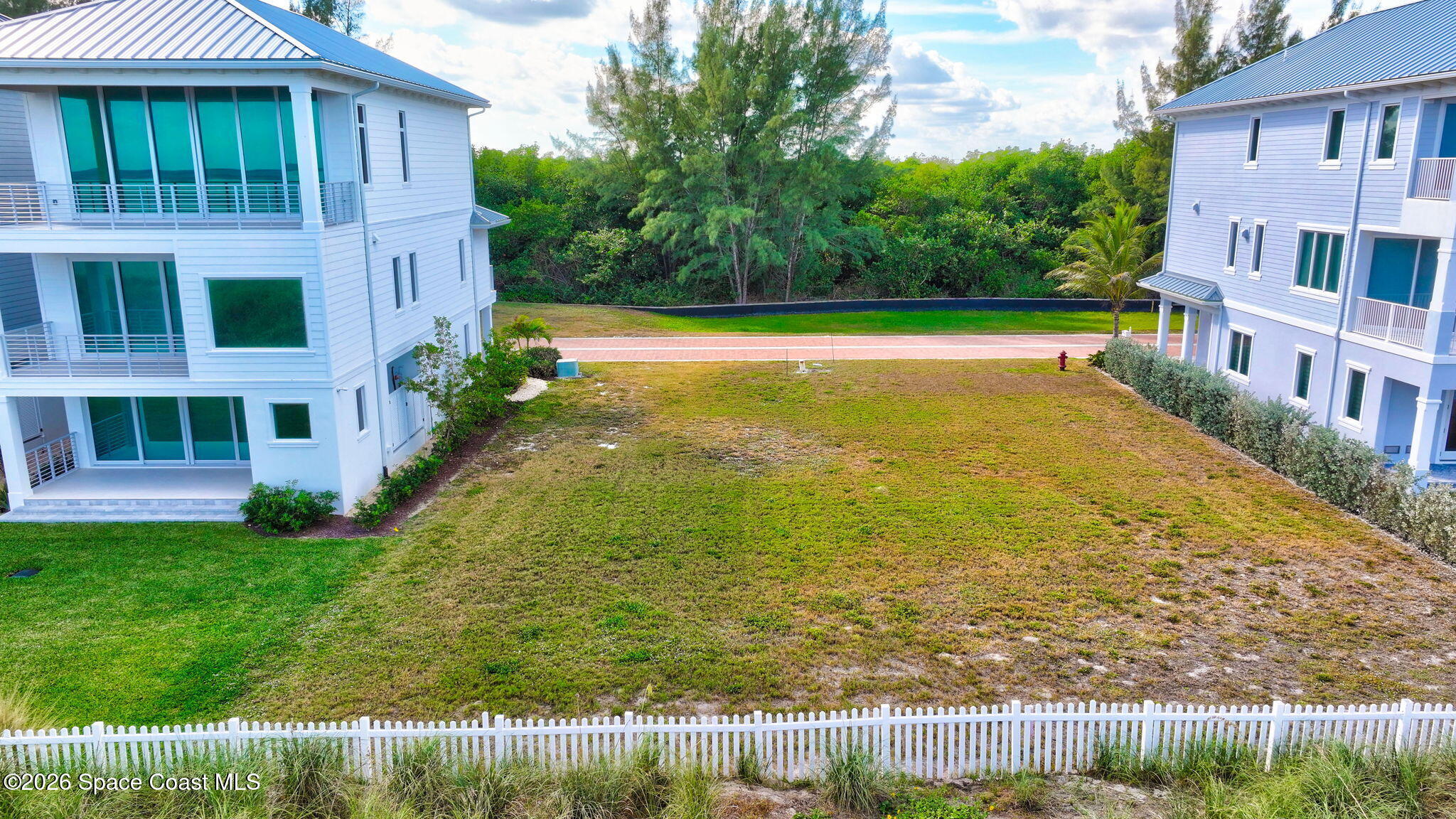 5144 Watersong Way Fort Pierce, FL 34949 - Photo 13 of 29 a view of a swimming pool with an outdoor space and seating area